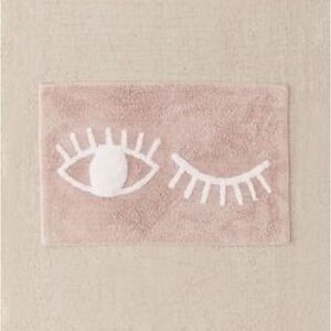URBAN OUTFITTERS Soft Pink/White Winky Eye Bath Mat